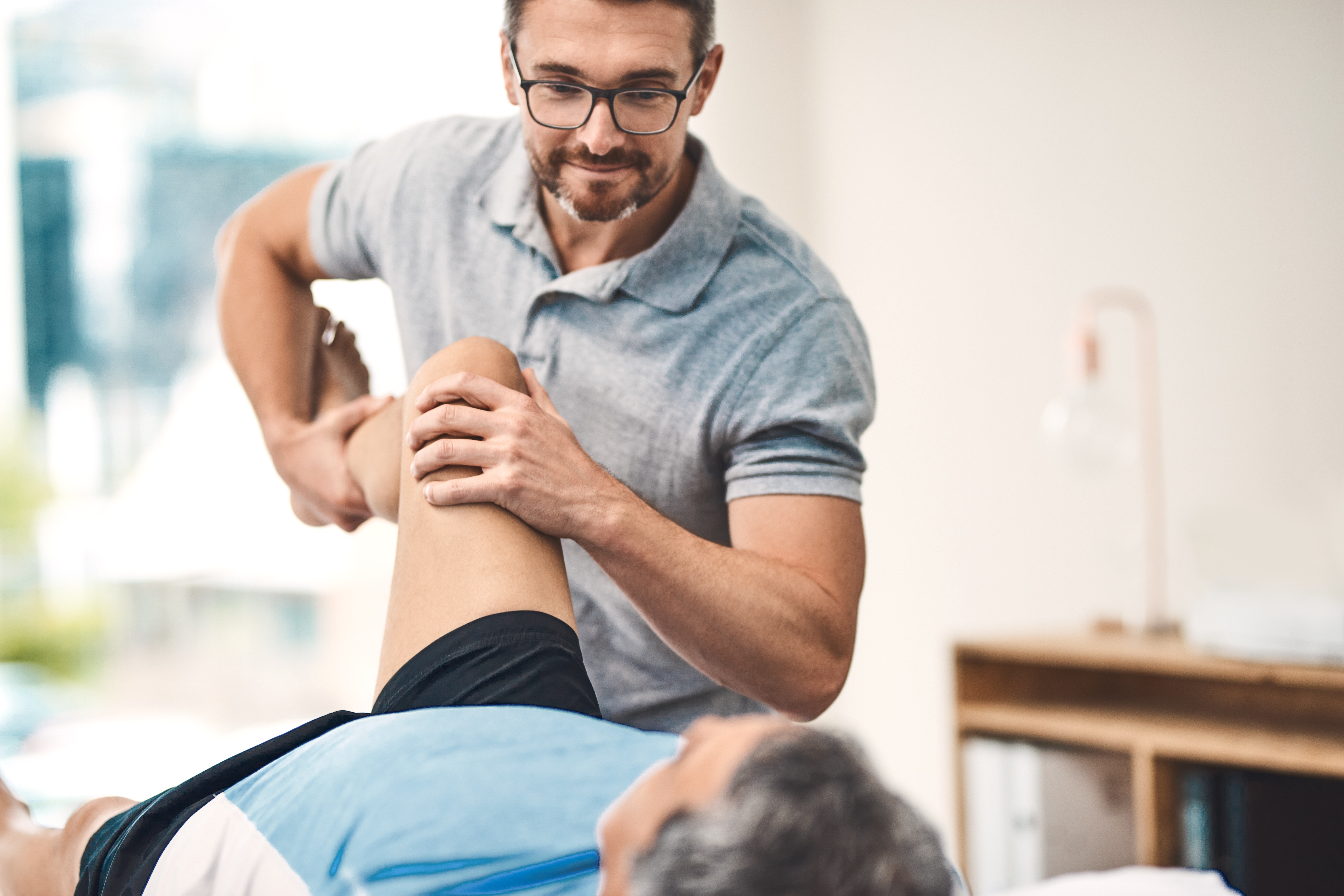 Physical therapist treating patient